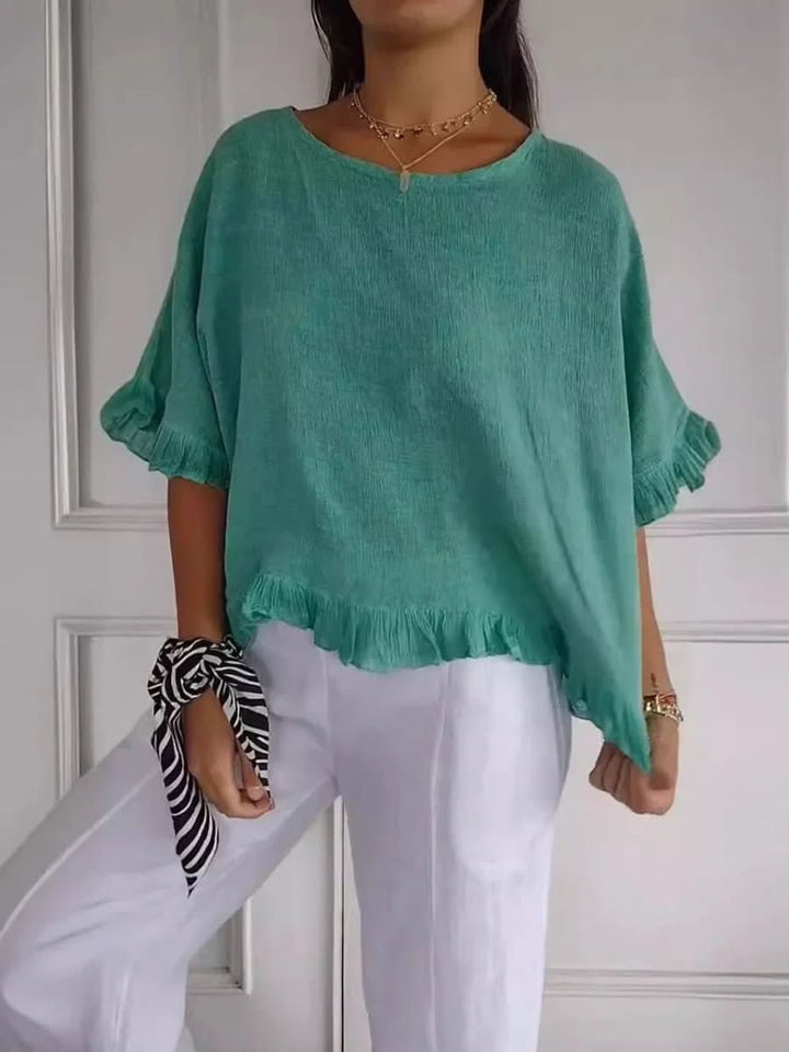 Effortless chic women's ruffle blouse, a versatile & flattering top for office, casual, or summer fashion.