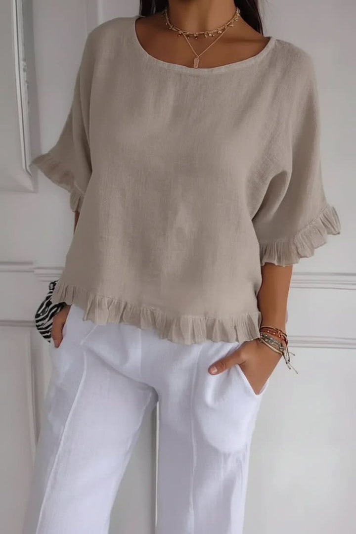 Modern women's elegant ruffle blouse, a chic and lightweight top offering a flattering fit for contemporary style.