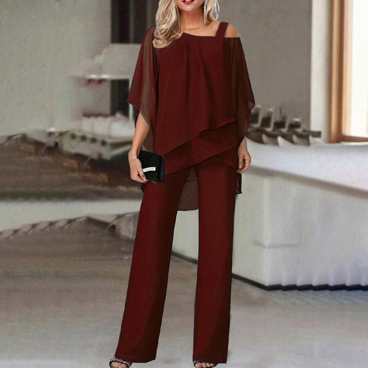 Women's chic two-piece set: asymmetric top & straight leg pants in red, white, or black. Versatile for office or casual.