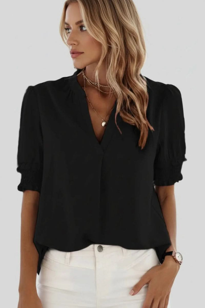 Comfortable women's V-neck blouse with chic puff sleeves. Elegant and flowy for easy spring/summer style.