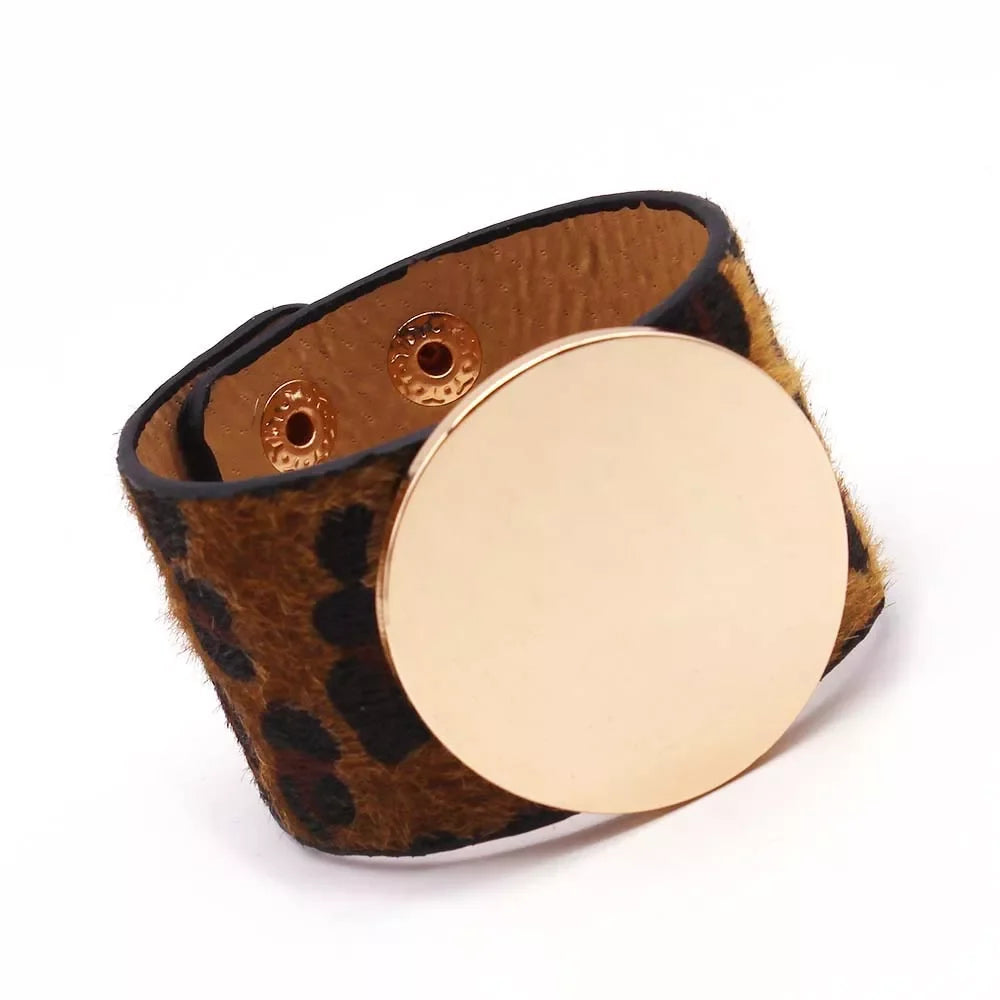Statement women's wrap bracelet with wild leopard animal print, a chic arm accessory.