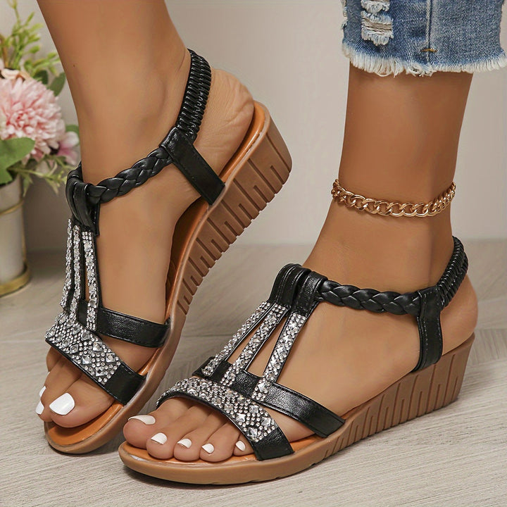 Sparkling women's woven flat sandals with dazzling rhinestone embellishments for chic summer style.