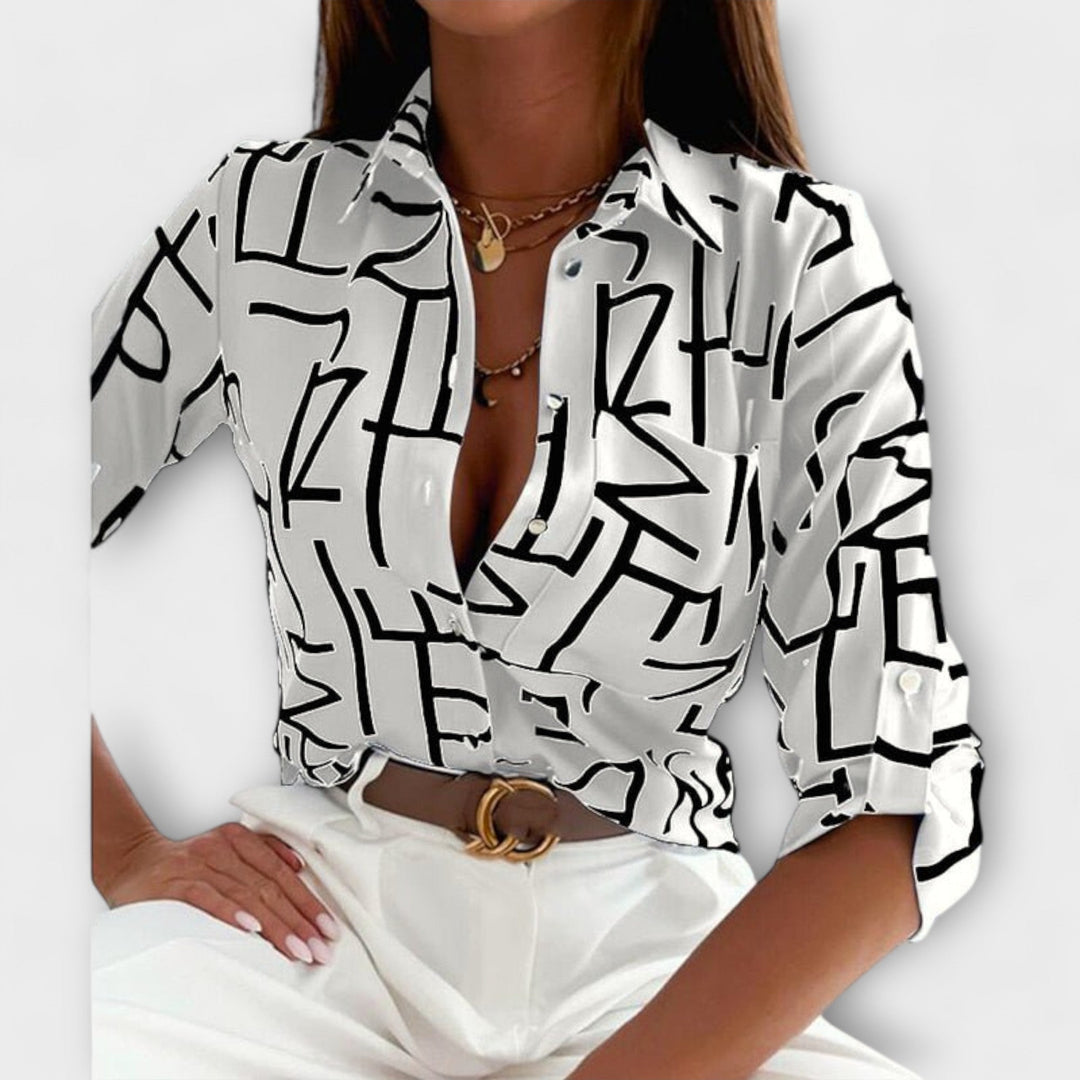 Stylish & comfortable women's classic collar blouse. A versatile button-down top for elegant workwear or casual chic.