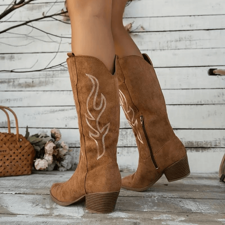 Stylish women's western boots. Features detailed embroidery, a pointed toe & comfortable block heel.