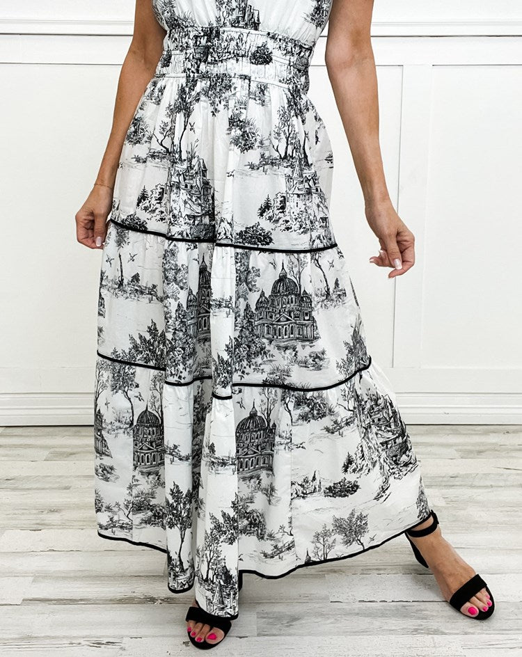 Casual yet elegant women's long Toile dress. Smocked waist, V-neck, and tiered design for summer comfort.