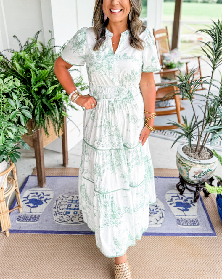 Classic Toile print women's long dress, featuring a smocked waist and tiered skirt for spring elegance.