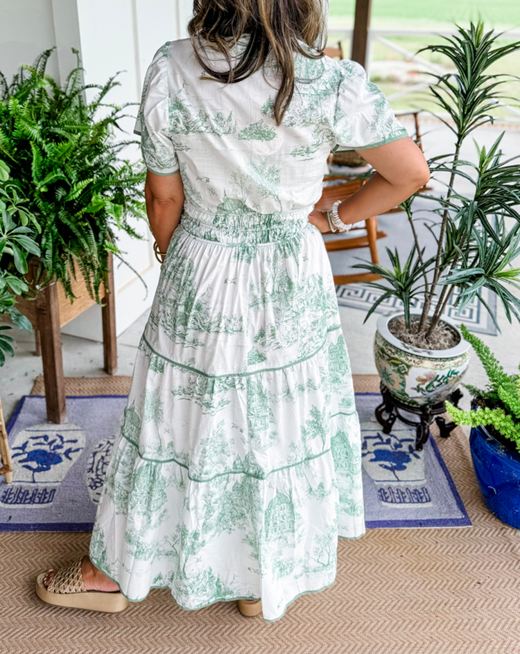 Elegant Toile Maxi Dress for women. Comfortable V-neck, smocked waist, tiered design. Perfect spring style.