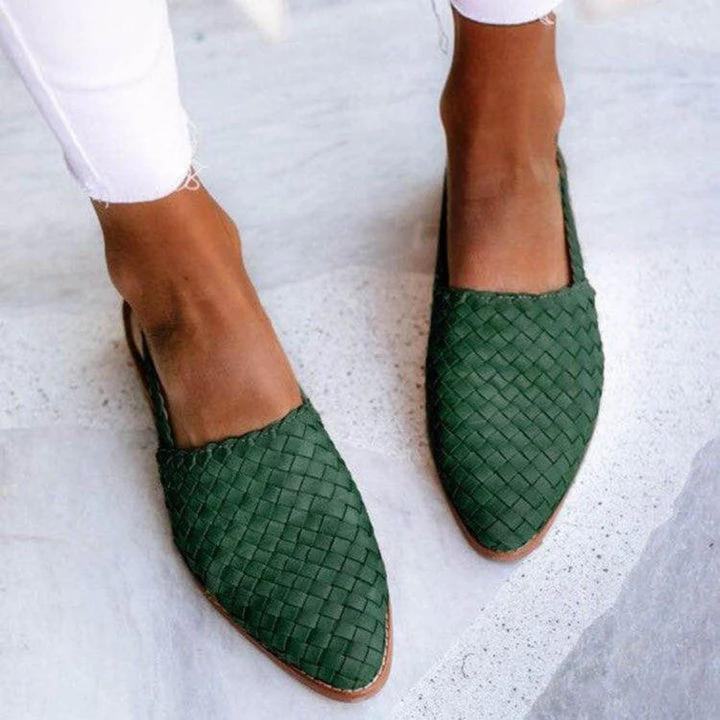 Comfortable closed-toe woven slip-on mules for women, featuring a pointed toe and flat heel for everyday wear.