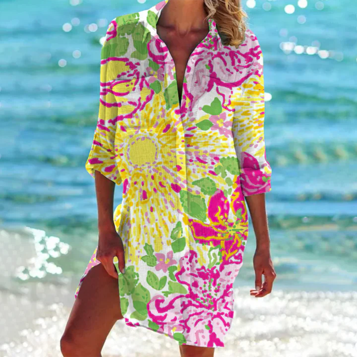 Flowy women's summer mini dress, collared & buttoned, great for beach days, vacation, or casual outings.