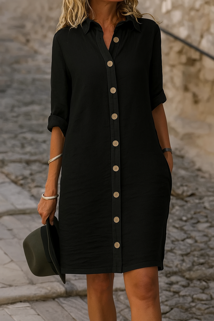 Women's knee-length collared shirt dress, button front, roll-tab sleeves, great for casual elegance.