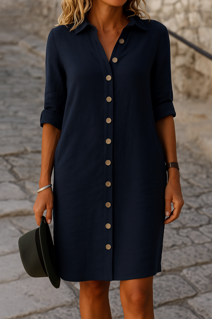 Women's comfortable shirt dress, button front, roll-tab sleeves, perfect for everyday summer wear.