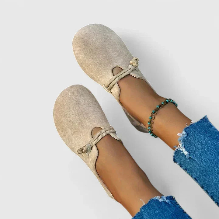 Comfortable women's travel flats with a wide toe box & rope strap, orthopedic friendly for all-day wear.