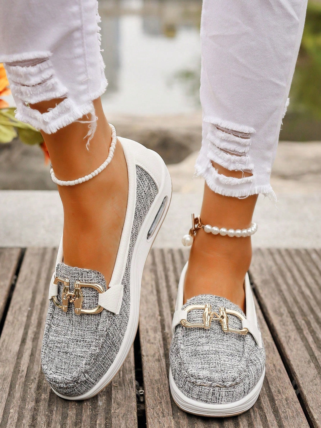 Versatile women's gold buckle slip-on loafers, offering premium comfort for everyday style.