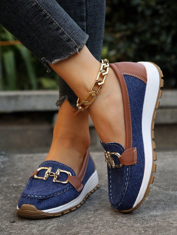 Everyday women's gold buckle loafers, providing slip-on ease and versatile comfort.