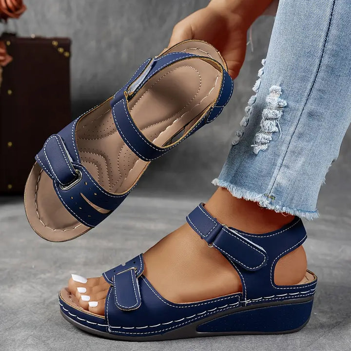 Women's casual wedge sandals featuring adjustable straps and cushioned footbed for ultimate comfort.