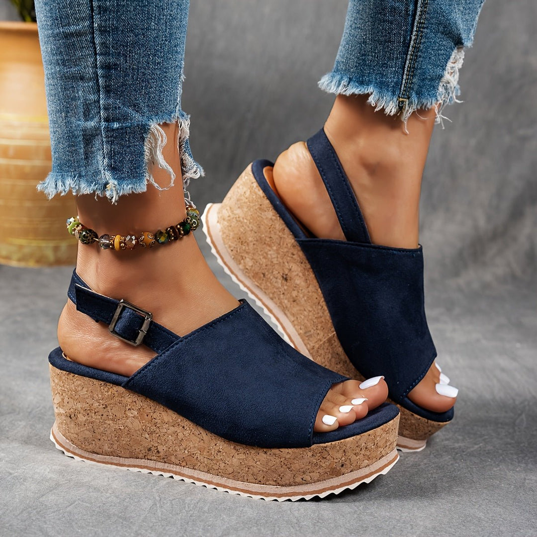 Women's platform wedge sandals in stylish leopard print, comfortable and perfect for warm summer days.