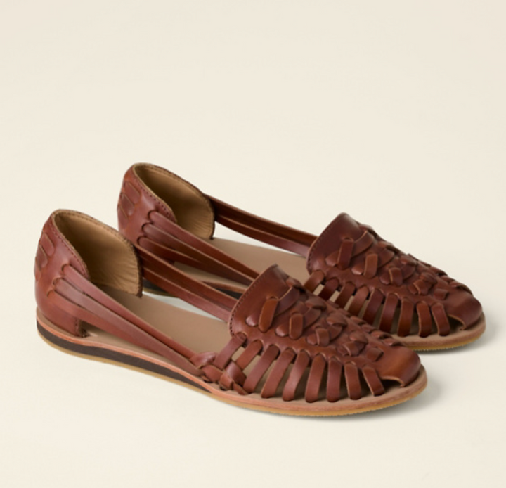 Elegant women's flat slip-on sandals, ideal for comfortable summer walks & effortless casual styling.
