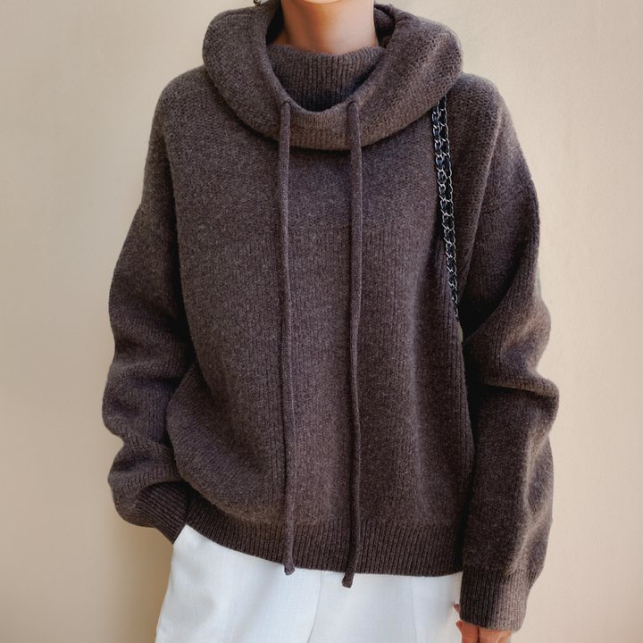 Cozy women's high neck pullover sweater, essential warm apparel for comfortable fall and winter outfits.