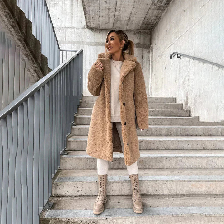 Casual chic women's longline teddy coat. Warm & stylish ladies jacket, perfect for fall and winter comfort with a cozy feel.