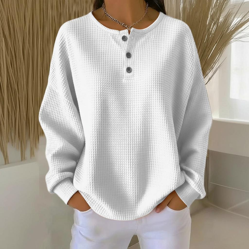 Stylish orange women's waffle knit sweater, a cozy textured pullover with a relaxed fit for autumn fashion.