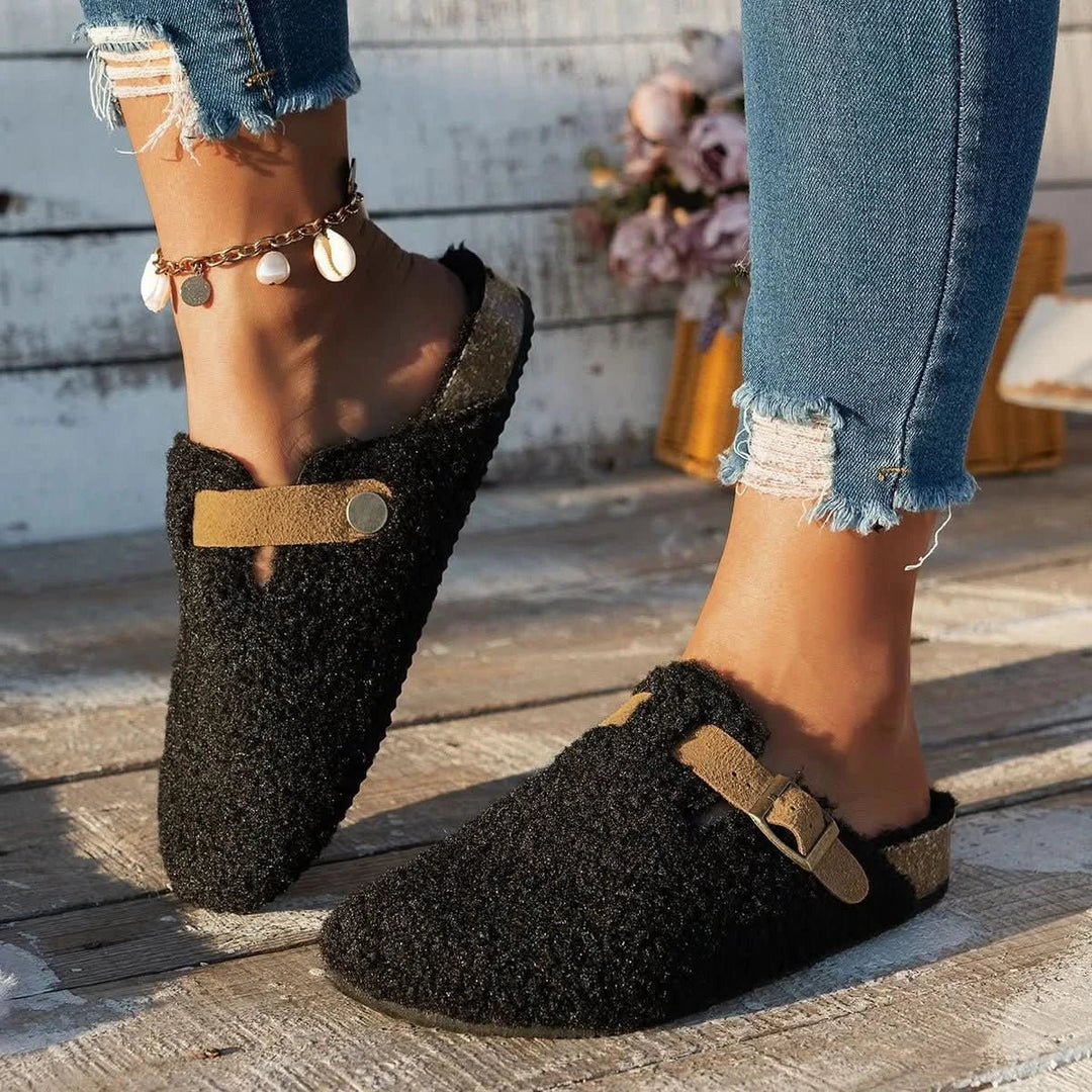 Comfortable women's winter mules with anti-slip sole, warm and soft slip-on footwear for cozy lounging.