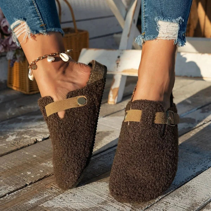 Fashionable women's cozy winter mules, providing ultimate warmth and stylish comfort for cold days.