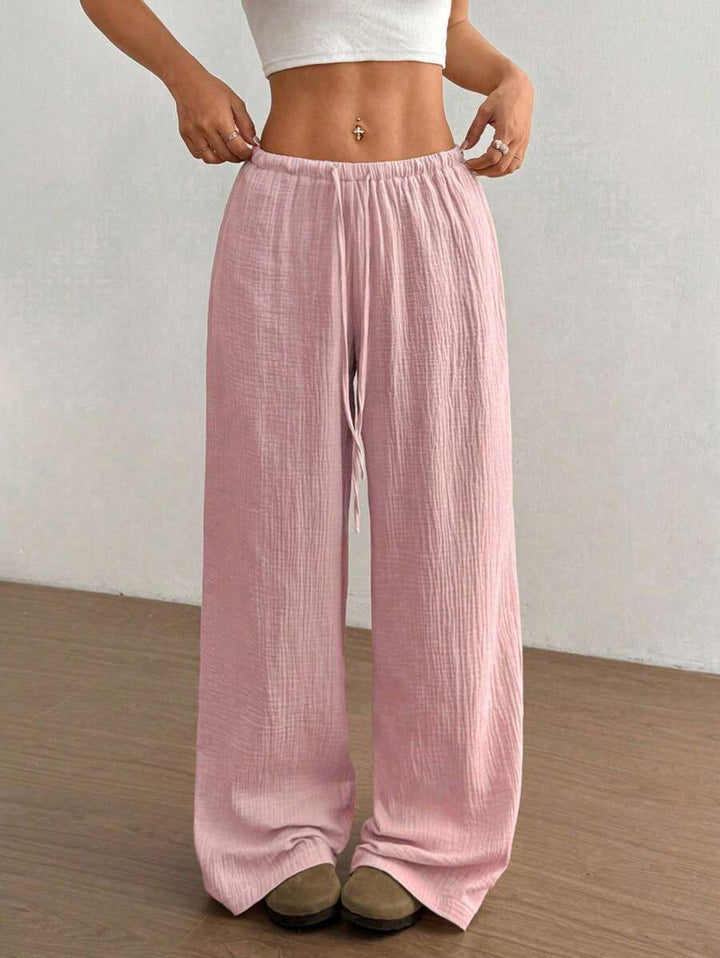 Women's crinkle texture wide leg drawstring pants, relaxed fit for ultimate comfort & style.