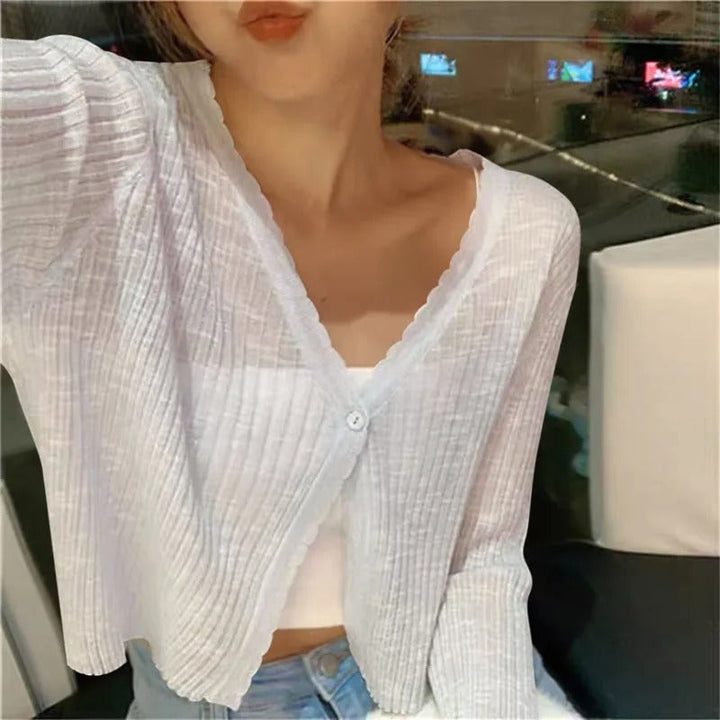 Stylish women's cropped cardigan with front buttons, a versatile long-sleeve layering top for casual summer wear.