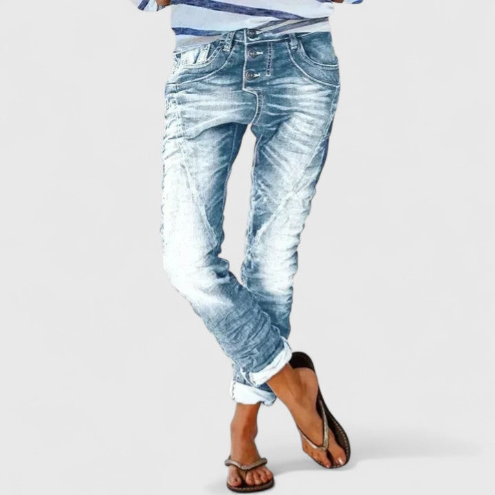 Soft gray women's distressed jeans, wide leg, ripped knees, a casual vintage fashion statement.