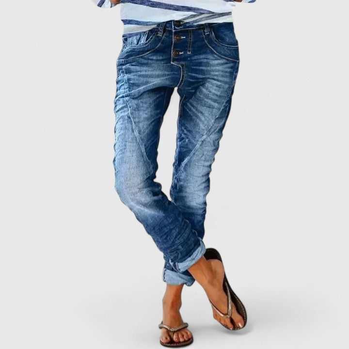 Women's wide leg distressed jeans, chic casual wear, mid-rise fit, vintage-inspired fashion pants.