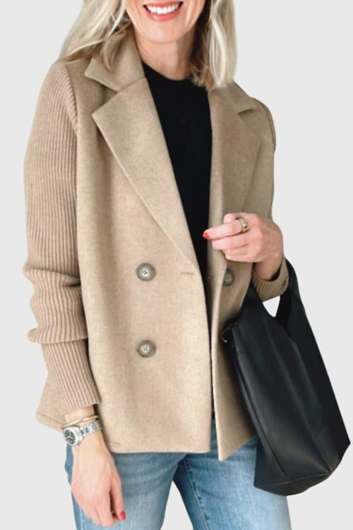Chic women's outerwear: double-breasted blazer with stylish, comfy contrast sleeves for any occasion.