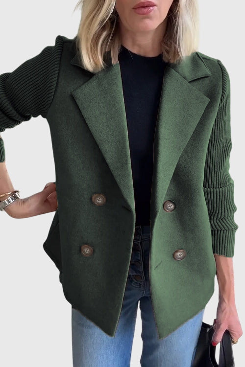 Modern double-breasted women's blazer with soft, contrasting sleeves, perfect for a professional look.