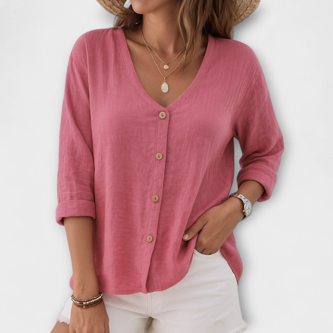 Comfortable women's button-up blouse with a relaxed fit, V-neck, and long sleeves for easy everyday style.