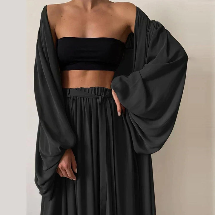 Stylish women's summer 3-piece outfit with a trendy blazer, sleeveless top, and relaxed fit pants. Comfortable & elegant.