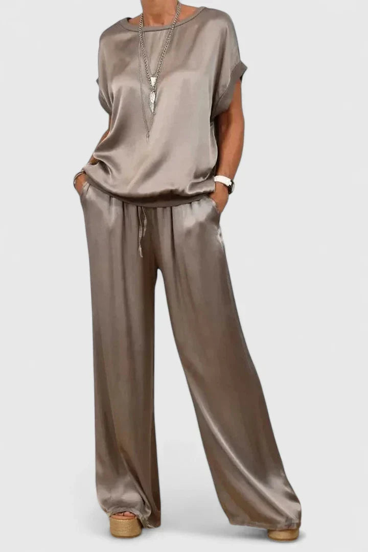 Stylish women's two-piece batwing top and wide leg pant matching outfit, ideal for versatile elegant or casual wear.