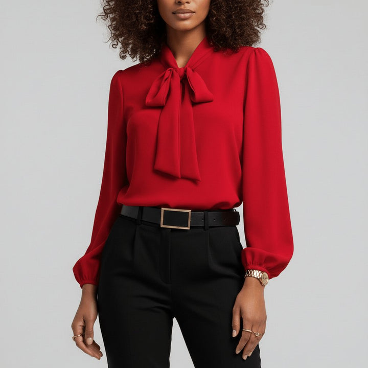 Women's elegant bow tie neck blouse with puff long sleeves for office wear.