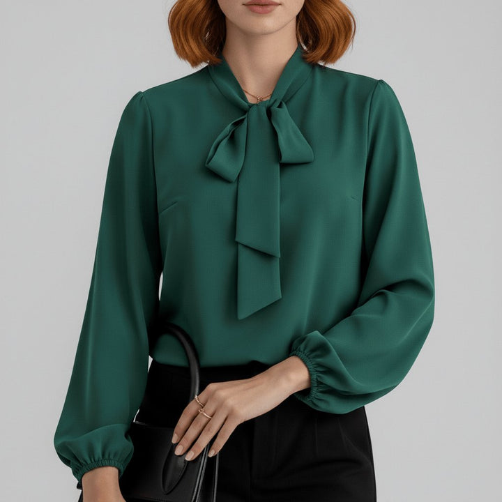 Stylish women's puff sleeve blouse, featuring a chic bow tie neck, perfect for formal or casual.
