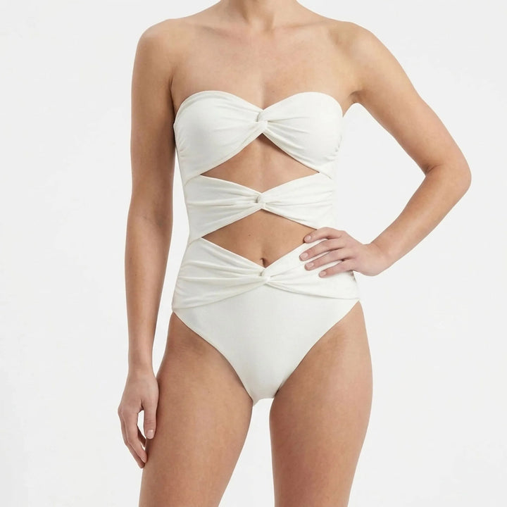 Two-piece women's beach set: elegant cutout monokini & a sheer resort skirt cover-up.