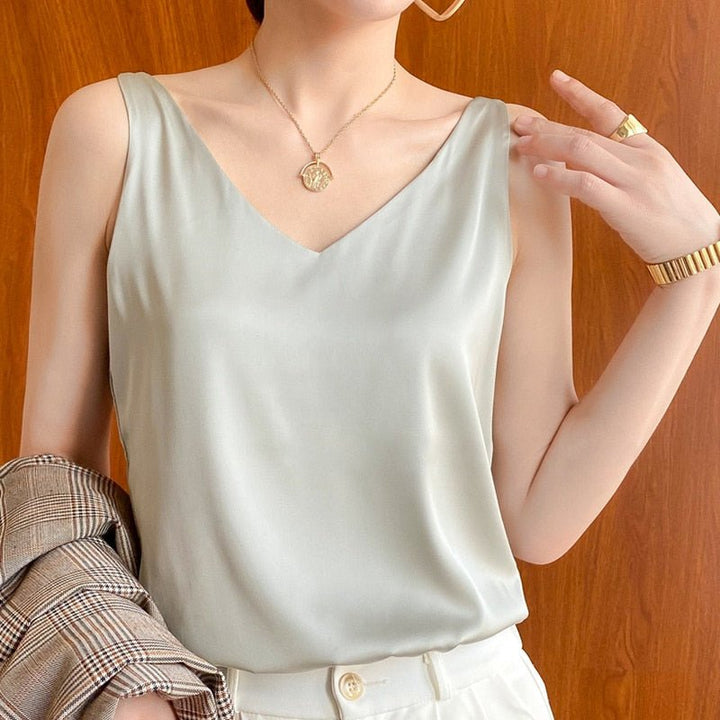 Smooth draped elegant women's tank top, a stylish and comfortable sleeveless blouse for ladies.