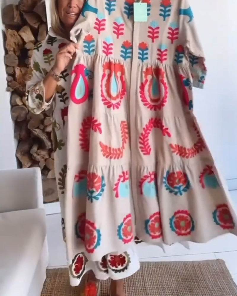 Stylish women's midi dress featuring vibrant floral graphic & lapel collar, ideal for summer style.