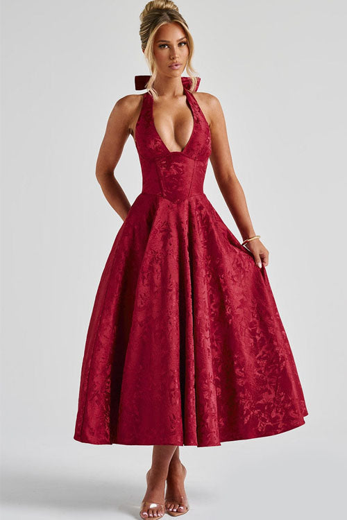 Graceful women's halterneck A-line maxi dress, perfect for a wedding guest or formal evening.