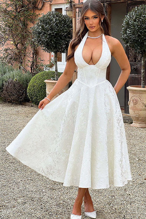 Rear view of a sophisticated A-line homecoming dress with a unique halterneck design. Long & elegant.