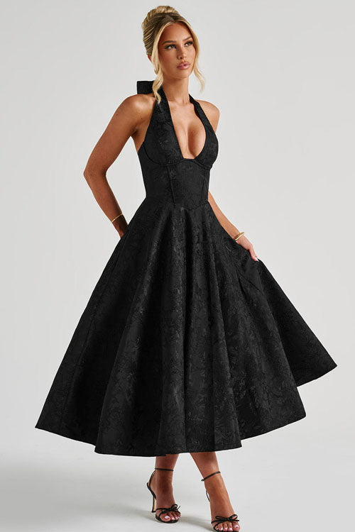 Close-up of the corset bodice on a women's elegant A-line halterneck maxi dress, formal attire.