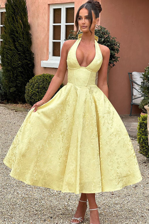 Front view: Stylish women's A-line maxi dress with a sophisticated halterneck and long flowing skirt.