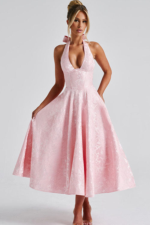 Women's long A-line formal dress with a stylish halterneck & elegant flow, suitable for evening wear.