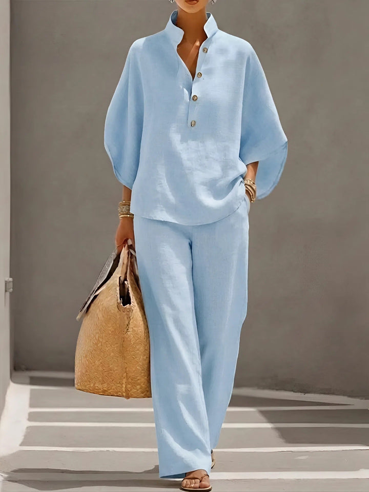 Stylish women's summer outfit: mandarin collar top and wide-leg trousers two-piece set.