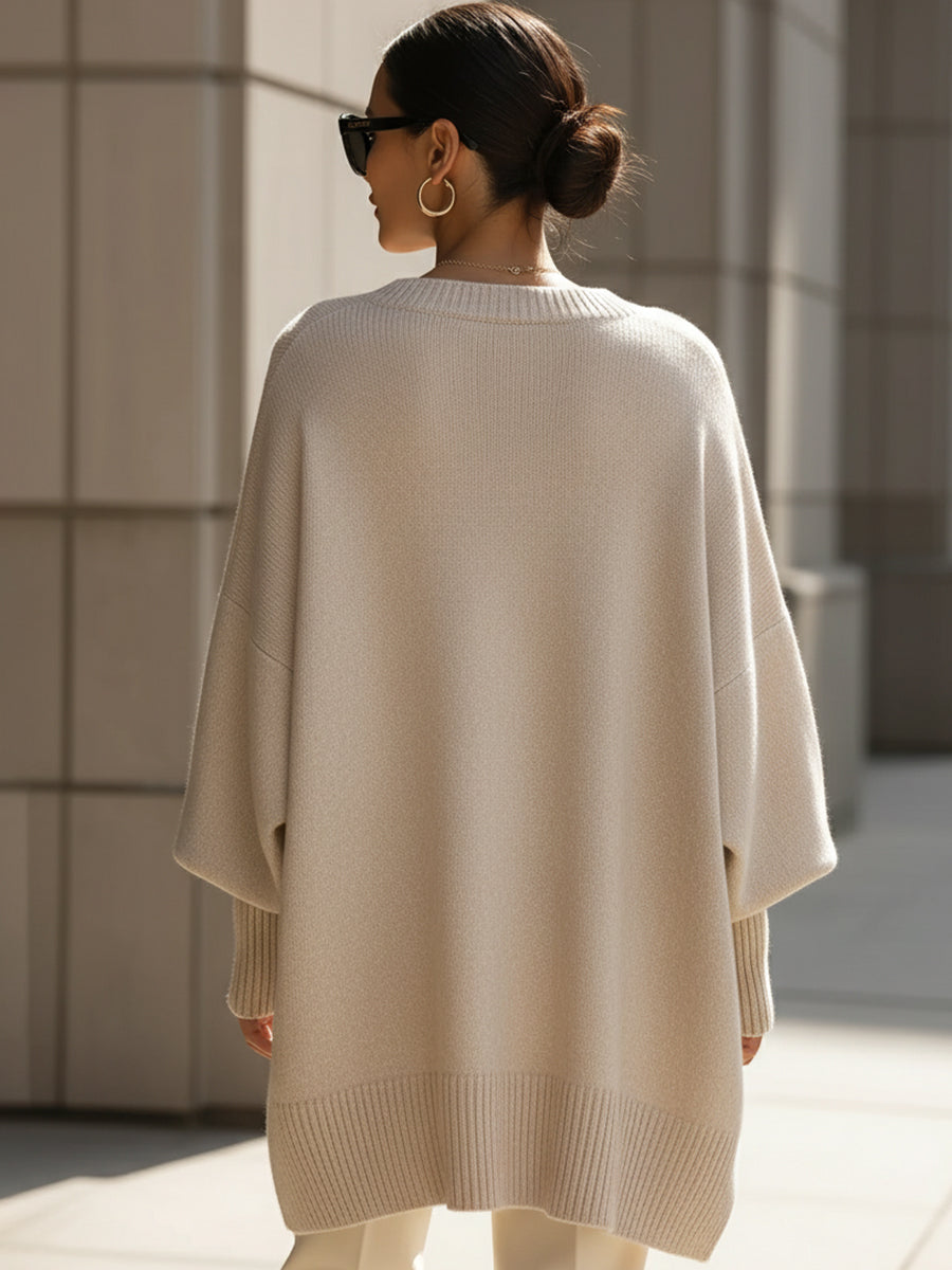 Soft knit oversized women's sweater poncho, offering cozy comfort and elegant style for autumn.