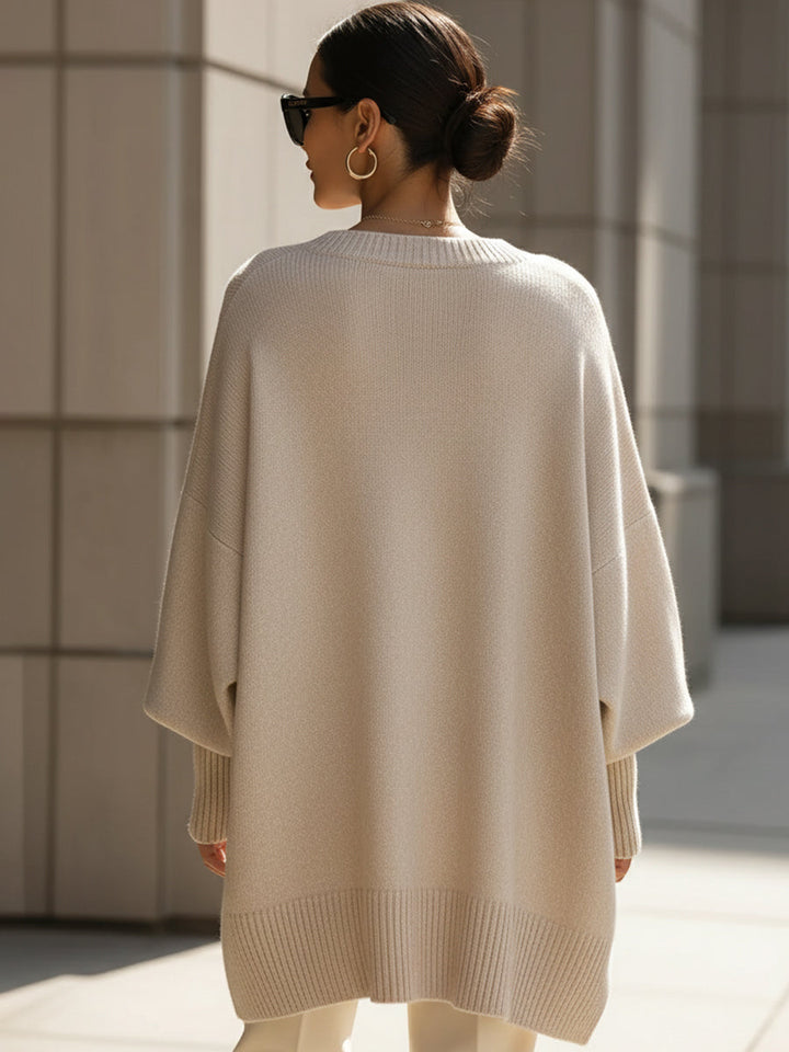Soft knit oversized women's sweater poncho, offering cozy comfort and elegant style for autumn.