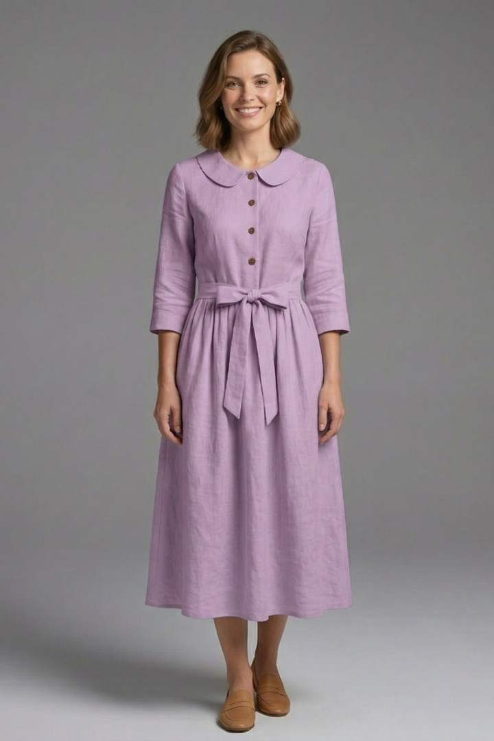 Flowy women's midi dress with V-neck and waist tie. Elegant and comfortable, ideal for summer movement.