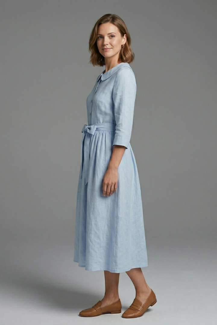 Back view of a women's versatile midi dress, showcasing its elegant design. Ideal for summer clothing.